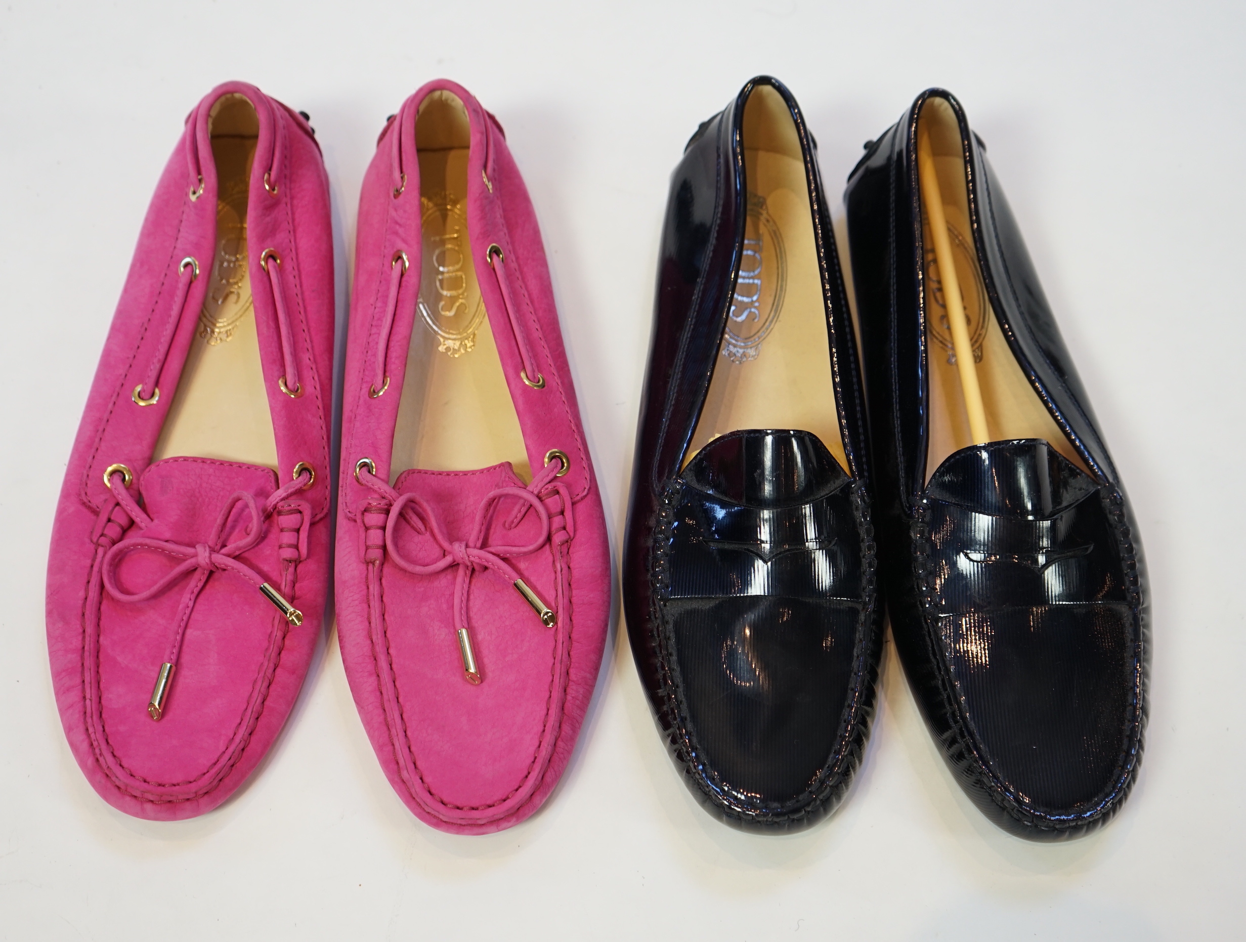 Two pairs of Tod's lady's driving shoes, one pink suede and the other dark blue patient leather, size EU 40